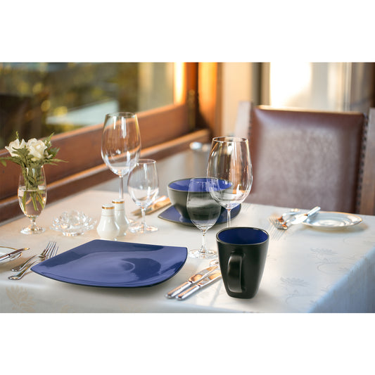 Set table for a dinner with cutlery such as fork or spoon beautifully arranged healthy food like fruits and vegetables and drinks in mugs such as coffee, juice and milk